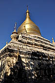 Bagan Myanmar. Next to the Gubyaukgyi stands the gilded Myazedi or 'Emerald Stupa'. 